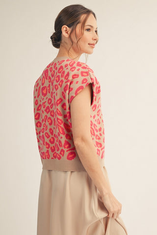 Women's taupe knit top with pink leopard print and short cap sleeves, back view