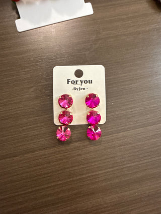 Hot pink triple rivoli crystal drop earrings in gold-tone prong settings on display card