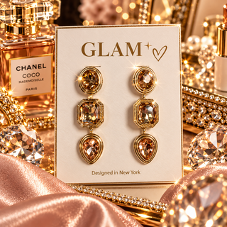 Gold-toned three-tier dangle earrings with champagne crystal round, octagon, and teardrop stones