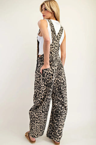 EE:SOME leopard print wide-leg overalls worn over white sleeveless crop top, back view