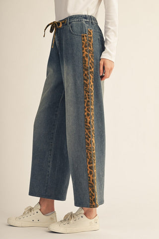 Wide-leg medium wash jeans with leopard print side stripe and drawstring waist
