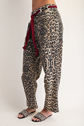 Leopard print drop-crotch pants with burgundy rope tie waist and patch pockets