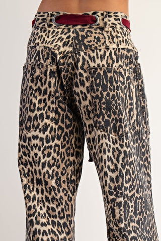 Leopard print wide-leg pants with red rope belt and patch pockets, back view