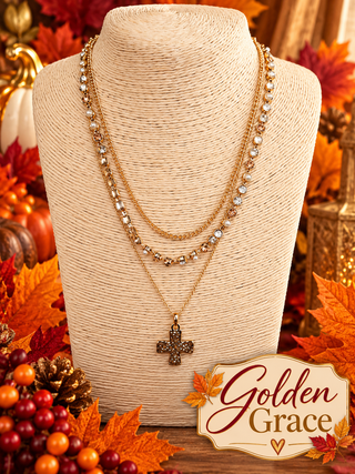 Gold-tone 3-layer necklace set with rhinestone choker, beaded chain, and pavé cross pendant