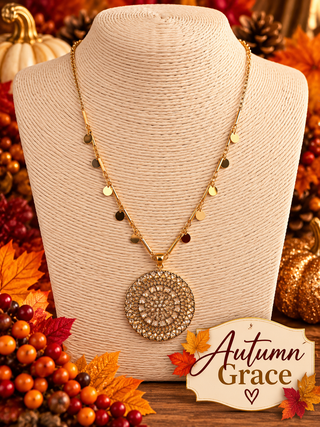 Gold tone chain necklace with disc charms and large mandala medallion pendant