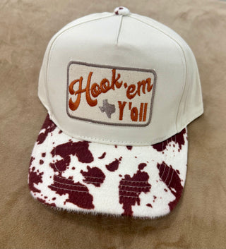 Cream snapback cap with cowhide brim and Hook em Yall Texas embroidered patch