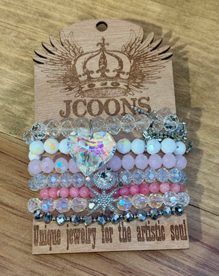 Stacked stretch bracelet set with pink crystal beads, iridescent heart and starfish charms