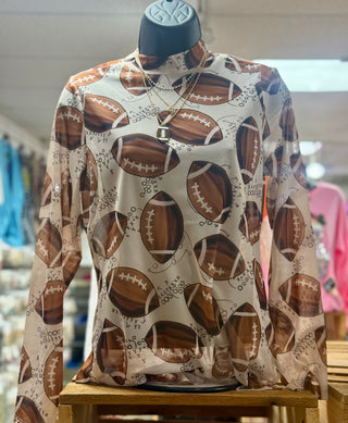 Long-sleeve mock neck top with allover watercolor football print on beige mesh fabric