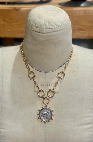 Gold chain necklace with snaffle bit links and silver horse coin pendant