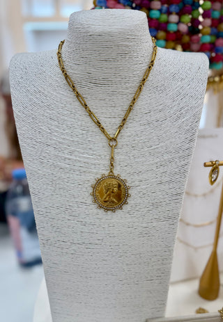 Gold paperclip chain necklace with large coin medallion pendant and crystal border