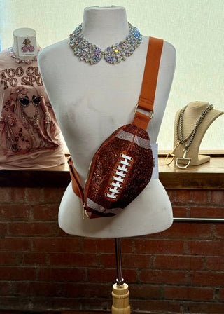 Glitter burnt orange football-shaped crossbody fanny pack with rhinestone lace detail