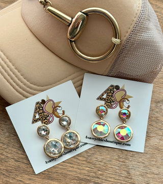 Gold-toned bezel drop earrings in clear crystal and iridescent AB rhinestone styles