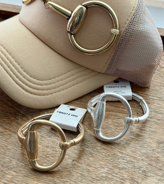 Gold and silver stretch band rings with equestrian horse bit metal centerpiece detail
