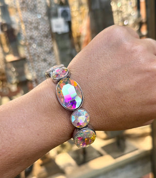Iridescent crystal stretch bracelet with silver-tone bezels displaying rainbow light refraction