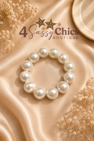 Stretch bracelet with large round white faux pearl beads on satin fabric