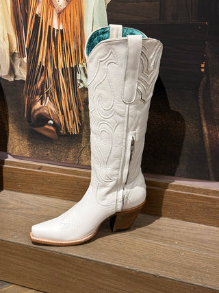 White leather cowboy boot with embroidered stitching, square toe, and side zipper
