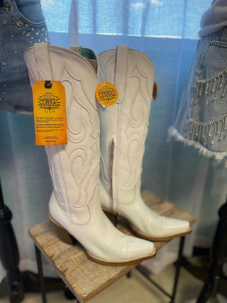 Corral white leather tall cowboy boots with embroidered stitch detailing on display