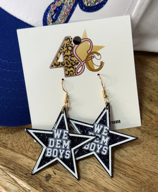 Navy glitter star dangle earrings with white trim and We Dem Boys lettering