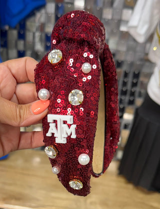 Maroon sequin knotted headband with Texas A&M logo, faux pearls, and rhinestone embellishments