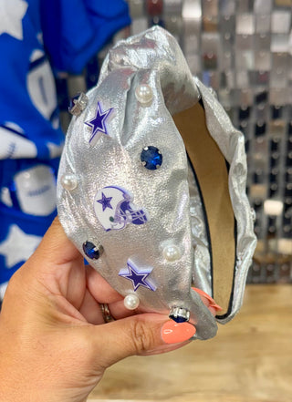 Silver metallic knotted headband with Dallas Cowboys stars, helmet appliqués, pearls, and blue rhinestones
