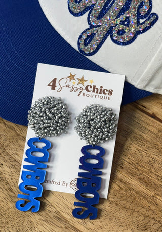 Silver seed bead stud dangle earrings with blue Cowboys word charm on display card