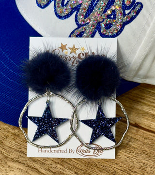 Navy pom-pom hoop earrings with glitter star charms, handcrafted by Cora's Den