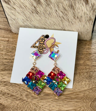 Multicolor rhinestone diamond-shaped drop earrings with iridescent stud tops on display card
