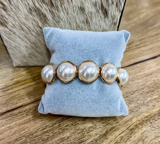 Gold-toned stretch bracelet with five large faux pearl cabochon bezels