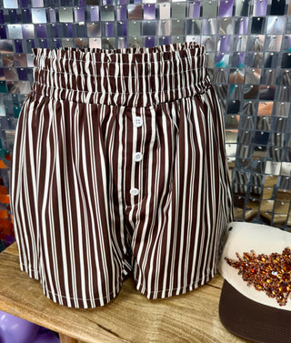 Brown and white vertical striped high-waist shorts with button-fly and elastic paperbag waistband