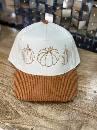 Cream structured cap with corduroy brim and embroidered pumpkin trio in rust thread
