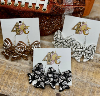 Rhinestone glitter bow dangle earrings in black, brown, and black-and-white colorways
