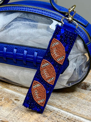 Blue sequin wristlet keychain fob with beaded football charms and rhinestone detailing