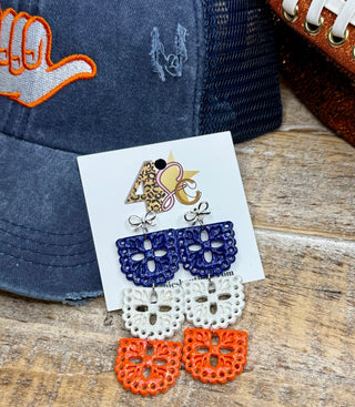 Three-tier navy white orange glitter filigree dangle earrings with silver bow studs