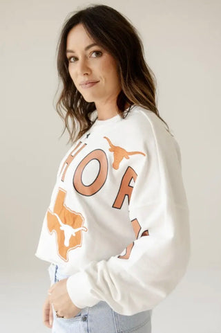 White University of Texas Longhorns graphic sweatshirt with burnt orange letters and logos