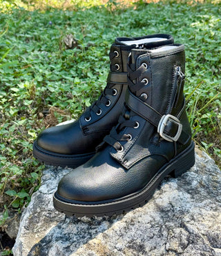 Black pebbled faux leather combat boots with lace-up front, silver buckle strap, and lug sole