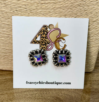 Square iridescent crystal stud earrings with ornate silver-tone sunburst beaded setting