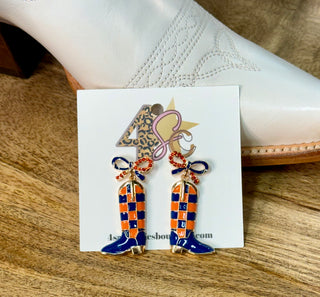 Navy and orange checkered cowboy boot dangle earrings with rhinestone bow accents