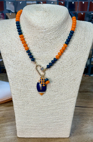 Navy and orange beaded necklace with enamel football pendant and gold carabiner clasp