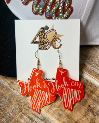 Orange Texas-shaped dangle earrings with Hook em Horns script and gold fish hook wires