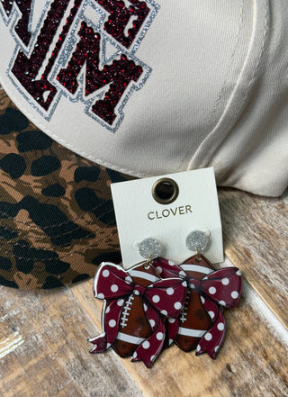Maroon polka dot bow football acrylic dangle earrings with silver glitter studs