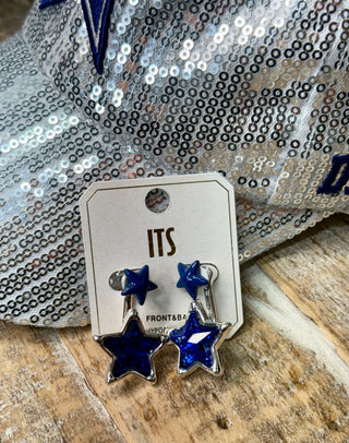 Blue glitter star front and back earrings on silver card display with sequin background