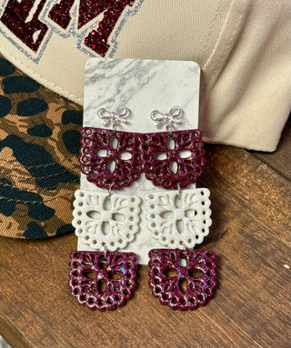 Maroon and white glitter lace papel picado dangle earrings with silver bow studs