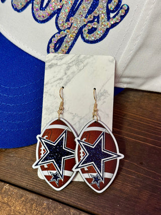 Dallas Cowboys star glitter dangle earrings on football-shaped acrylic with gold fish hooks