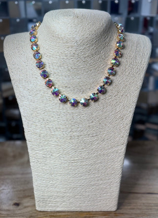 Iridescent crystal rivoli collar necklace in gold-tone pronged settings on display bust