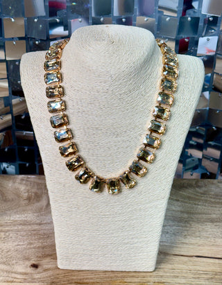 Gold-toned collar necklace with graduated champagne faceted crystal stones on bust display