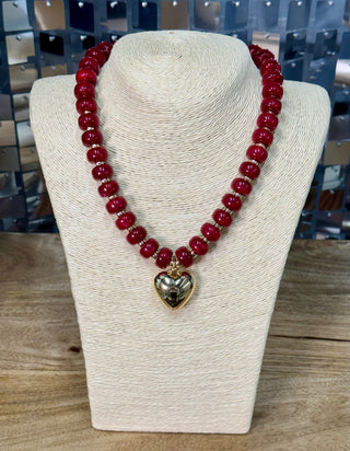 Red chunky beaded necklace with gold rondelle spacers and puffy gold heart pendant