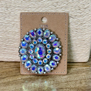 Round antique silver brooch with concentric rows of iridescent AB rhinestones on card