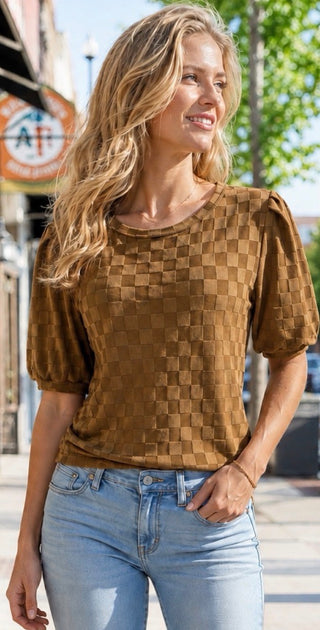 Caramel brown basketweave texture puff sleeve top paired with light wash jeans