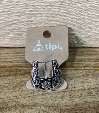 Silver filigree floral belt buckle with scrollwork and rope-textured border on display card