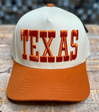 Cream snapback cap with burnt orange brim and bold 3D puff TEXAS embroidery